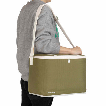 Green 20L cooler bag with shoulder strap for camping and festivals.
