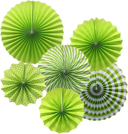 Decorative green paper fans for events and outdoor gatherings.