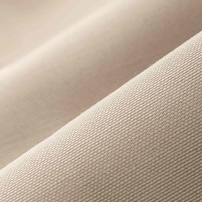 Close-up of beige toilettaske showing water-resistant material texture.